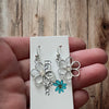 Cutie Patootie Flower Earrings – Silver Floral Dangles with Rhinestone Center