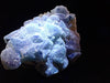 Crowned in Frost: Octahedral Blue Fluorite on Candle Quartz