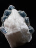 Crowned in Frost: Octahedral Blue Fluorite on Candle Quartz