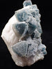 Crowned in Frost: Octahedral Blue Fluorite on Candle Quartz