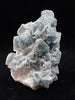 Crowned in Frost: Octahedral Blue Fluorite on Candle Quartz