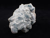 Crowned in Frost: Octahedral Blue Fluorite on Candle Quartz